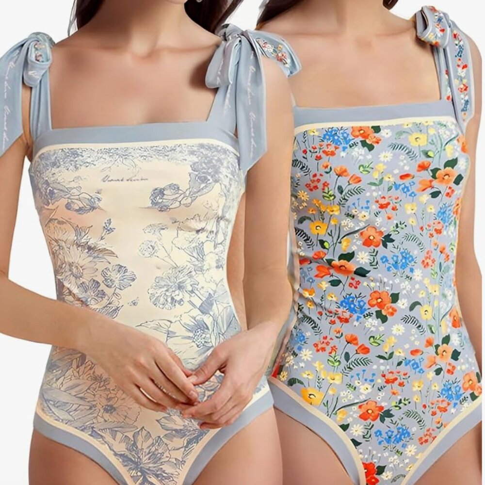 SALE! Reversible Floral/ Blue 1-piece swim. New. No tags. Size 6-8. Skays.